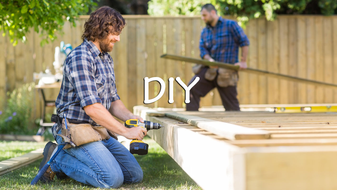 Two men building DIY deck